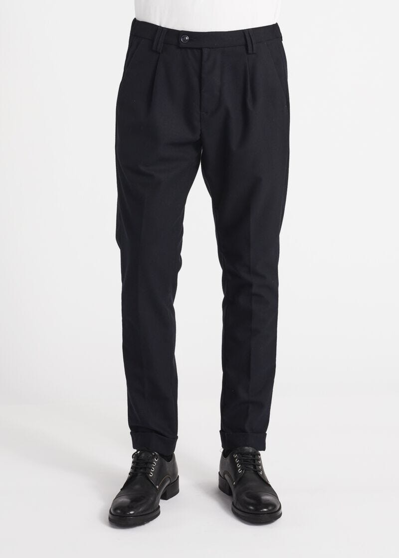 Trousers with elasticated waist insert