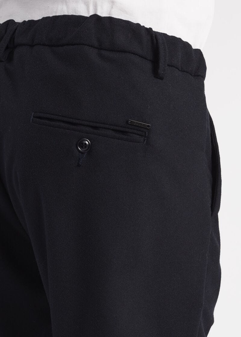 Trousers with elasticated waist insert