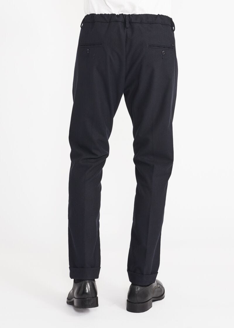 Trousers with elasticated waist insert