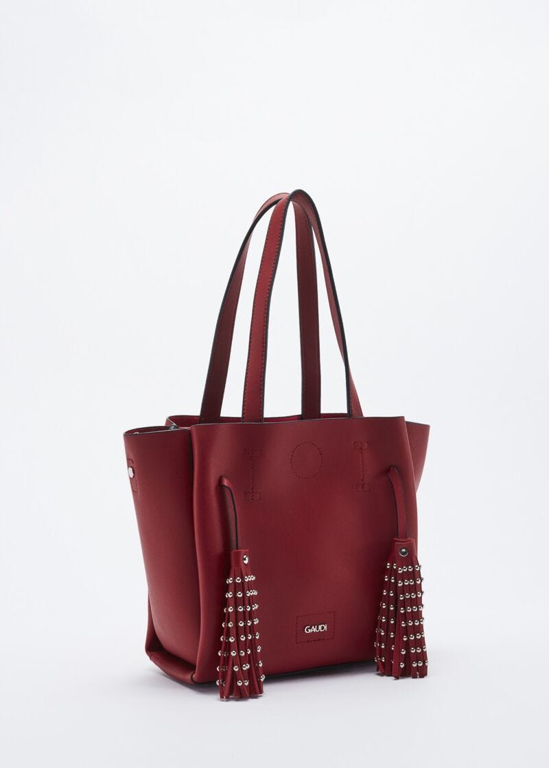 Bag with studded hanging tassels
