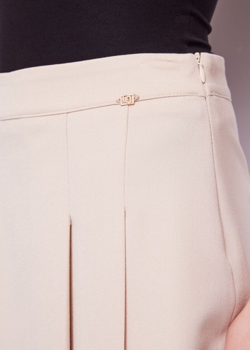 Beige pleated miniskirt