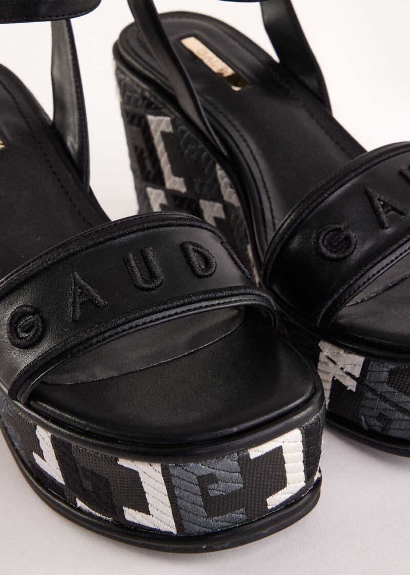 Black faux-leather sandals with logo