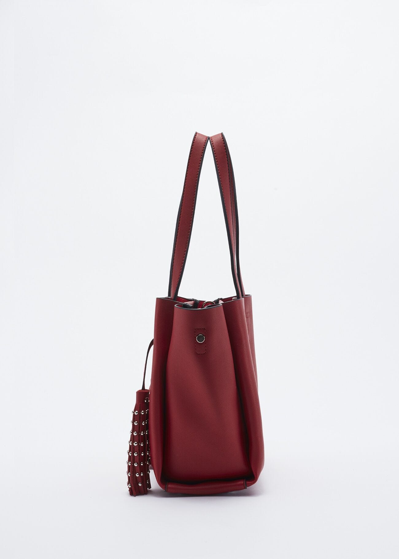 Bag with studded hanging tassels