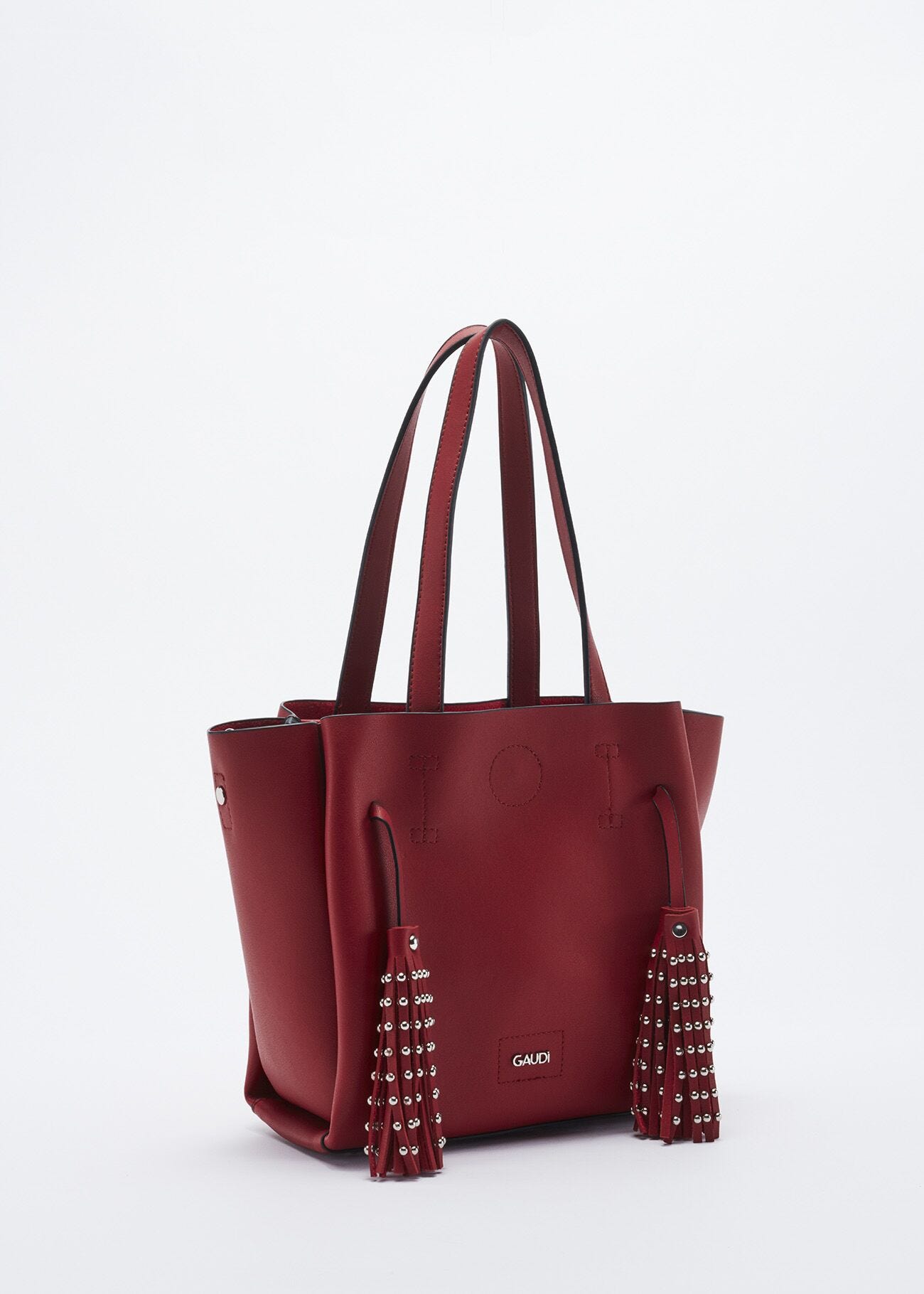 Bag with studded hanging tassels
