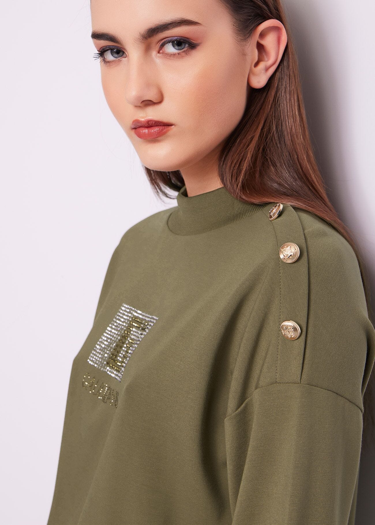 Sweat-shirt vert avec boutons