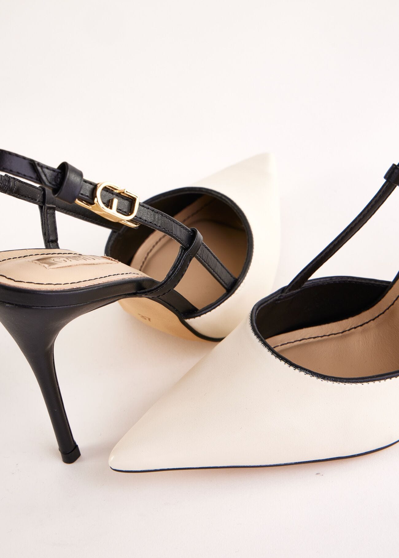 Black and white leather slingbacks