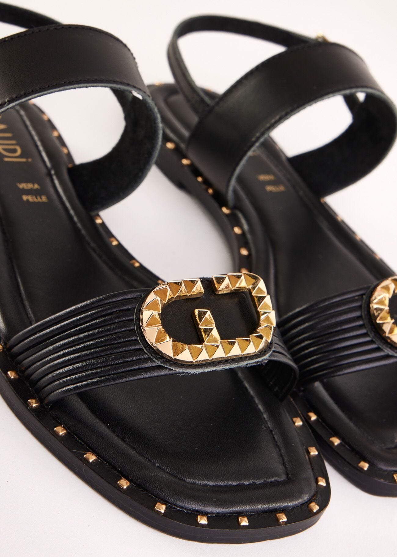 Flat black leather sandals