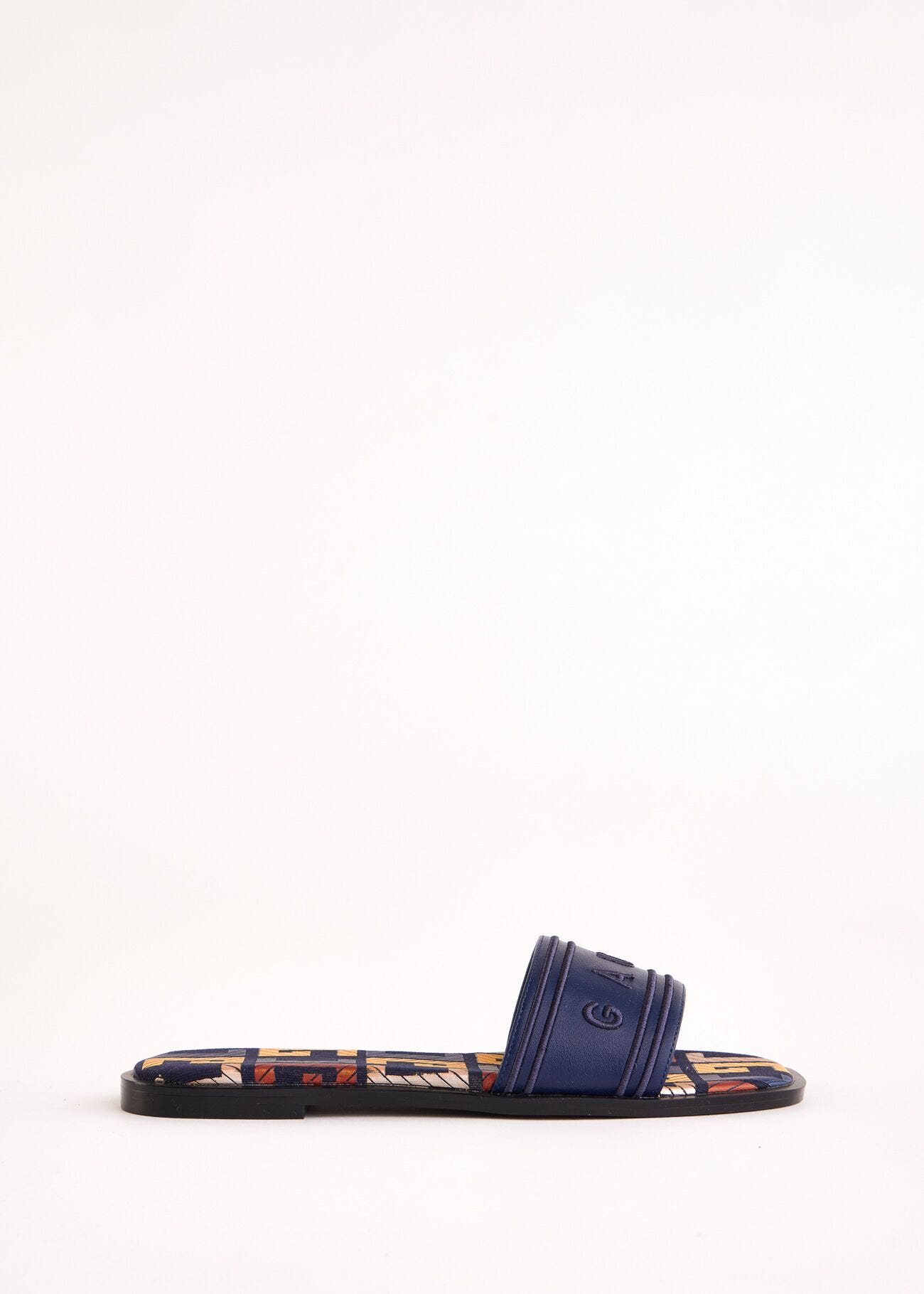 Mules bleues en matière synthétique