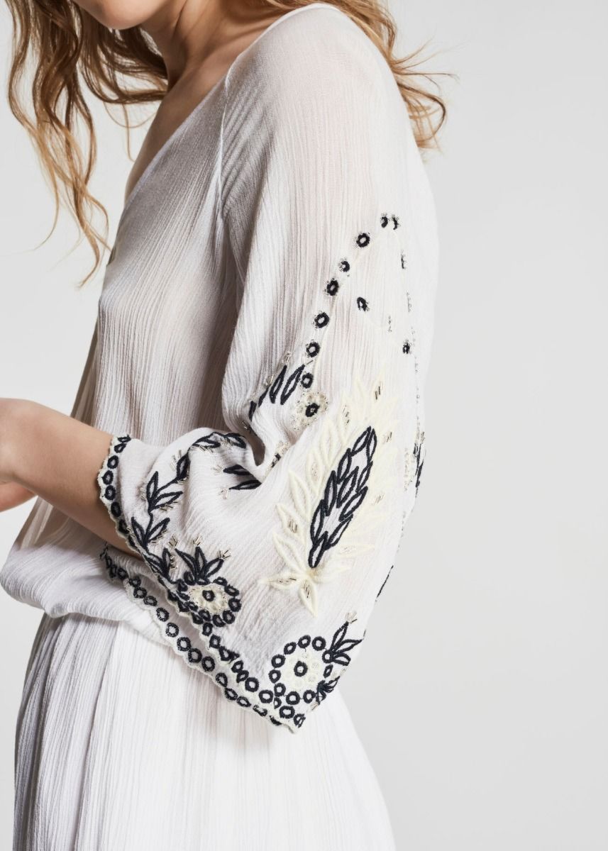 Dress with embroidered sleeves  